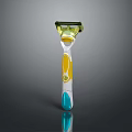 Modern Colorful Razor With Green Head Yellow Accents And Blue Handle Grip