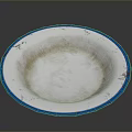 Round Sculpture Carving With Blue Rim White Interior And Textured Surface