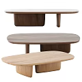 Three Modern Oval Shaped Wooden Coffee Tables In Different Natural Wood Tones