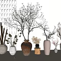 Brown and White Ceramic Vessels with Dried Flowers and Decorative Branches in Modern Home Decor
