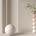 Modern Sculptural Art With Large Sphere And Stacked Neutral Toned Balls In Light Colored Setting