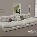 Three Seater Beige Sofa with Pillows Floor Lamp and Wall Painting on Wooden Floor