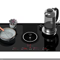 Modern Kitchen Induction Cooktop with Electric Kettle Mixing Bowl Whisk and Potted Plant