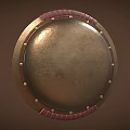 Ancient Bronze Shield with Red Leather Edging and Metal Rivets as Historical Weapon