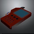 Red Handheld Device With Blue Screen Control Buttons And Colorful Cables