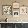 Four Abstract Paintings Hanging On Wall With Marble Counter Cabinet And Decorative Vase