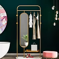 Modern Golden Hanger With Hanging Clothes Mirror Plant Shopping Bag Against Dark Green Wall