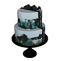 Two Tiered Cake With Black Green Brushstroke Decorations On Black Stand