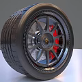 Car Tire With Alloy Wheel Rim Red Brake Calipers Silver Spokes And Gold Center Logo