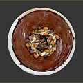 Delicious Chocolate Cake With Cream Base And Chocolate Drizzle Topped With Almonds And Chocolate Chunks