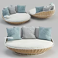 Round Wicker Outdoor Sofa With Light Blue And Gray Comfortable Cushions