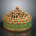 Golden Decorative Container With Intricate Openwork Carvings Green Red Gemstone Inlays And Small Top Ornament