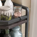 Black Rotating Countertop Kitchen Rack With Spice Jars Oil Bottles And Utensils