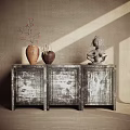 Vintage Console Cabinet with Three Textured Doors Decorated with Vases Sculpture and Light Shadows