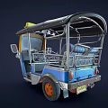 Three Wheeled TukTuk Taxi With Blue Yellow Body And Top Taxi Sign
