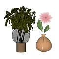 Textured Glass Vase With Gold Base And Green Foliage Alongside Amber Vase Holding Pink Dahlia