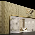 SKV Exhibition Booth With Golden Hexagonal Design Glass Facade And Innovation Beauty Interior