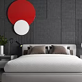 Modern Double Bed in Gray Textured Bedroom with Red White Circular Decorations and Bedside Tables
