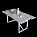 Rustic Wooden Dining Table with Metal Legs Featuring White Plates Green Glasses and Glass Bottle