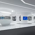 Modern Exhibition Hall Interior With White Curved Podiums And Blue Display Screens