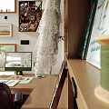 Cozy Study Room Interior With Large Windows Overlooking Green Trees And Bookshelves Filled With Books
