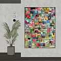Colorful Collage Artwork On Wall With Paper Fragments And Green Plant