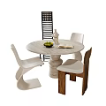 Round Marble Dining Table With Modern White And Wooden Chairs And Fruit Bowl