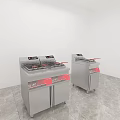 Two Silver Kitchen Fryers with Red Labels on Grey Floor and White Walls