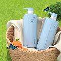 Light Blue Liquid Soap Bottles in Wicker Basket with White Cloth Grass Flowers and Butterflies