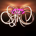 Modern Illuminated Ceiling Light with Curved Rings and Pink Center Design