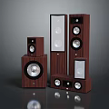 Wooden Computer Speakers With Various Sizes And Circular Drivers On Dark Surface