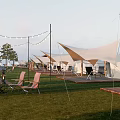Luxury Glamping Campsite With Grassy Area Lounge Chairs String Lights And Wooden Platforms