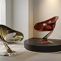 Modern Glossy Sculptural Chairs With Curved Lines On Display Stand In Interior Lighting