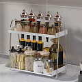 Organized Spice Bottles On White Rack For Modern Kitchen Counter With Gas Stove