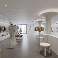 Modern Minimalist Clothing Store Interior With Hanging Apparel And Display Racks
