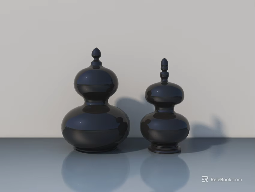 Two Black Gourd Shaped Decorative Sculptures On Smooth Surface With Light Background 3d model 