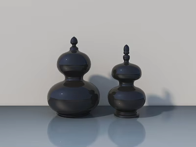 Two Black Gourd Shaped Decorative Sculptures On Smooth Surface With Light Background 3d model
