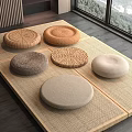 Round Fabric And Woven Cushions On Woven Mat In Modern Room Interior