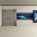 Gray Double Security Door At Modern Simple Lobby Entrance With Display Board And Blue Earth