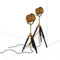 Vintage Brass Floor Lamps With Black Tripod Stand Against Gray Wall Background