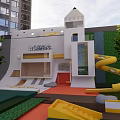 Modern Elevator Corridor In White Building With Slide And Playground Area Near Trees