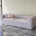 Light Beige Multi Person Sofa With Tufted Diamond Pattern And Cushions On Marble Floor 3d model