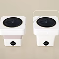 Two White Square Washing Machines With Black Circular Control Panels And Transparent Lids