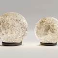 Two Round Table Lamps With Lunar Surface Texture And Modern Black Bases 3d model