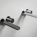 Sleek Modern Chrome Faucets Wall Mounted On White Bathroom Wall Design Style
