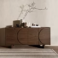 Wooden Entryway Side Cabinet With Circular Patterns And Decorative Vase On Beige Wall