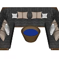 L shaped Gray Public Seating With Brown And White Cushions And Round Wooden Table