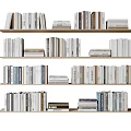 Various Books And Magazines Neatly Arranged On Multiple Wooden Bookshelves