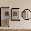 Three Different Shaped Mirrors Hanging On Wall With Black Frames Reflecting Artworks And Wooden Floors