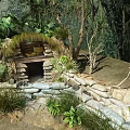 Garden Landscape With Forest Background Stone Built Arched Entrance Moss Covered Green Plants And Ferns